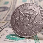 Close-up of a fifty cent coin highlighting its design and metallic composition