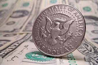 Close-up of a fifty cent coin highlighting its design and metallic composition