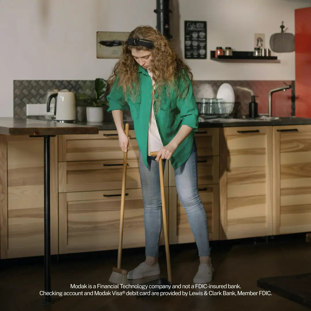 Teenage Girl Sweeping The Floor