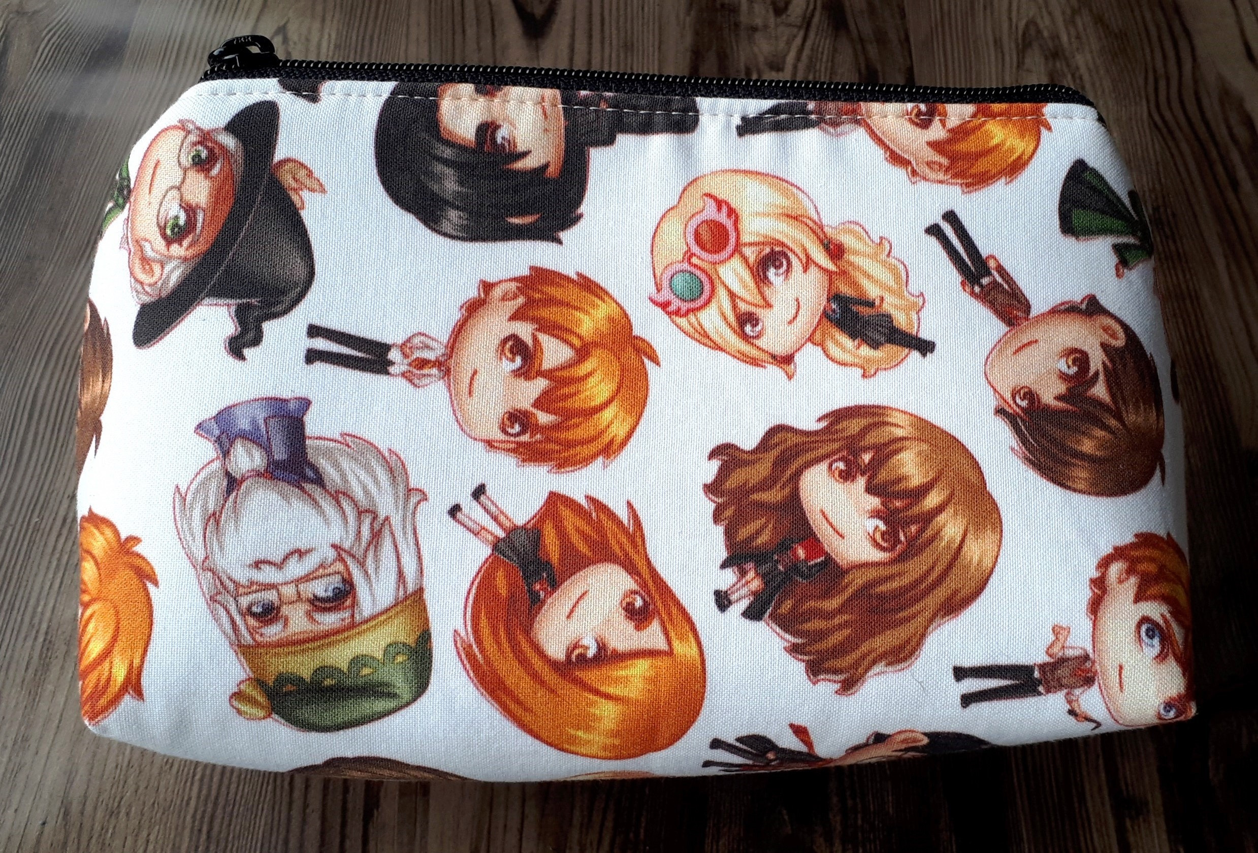 alt text: Harry Potter cosmetic bag with chibi characters from Booked For The Weekend