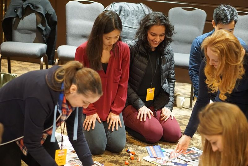 Group of Stack Overflow employees at a company meeting, highlighting the collaborative environment and the diverse team.