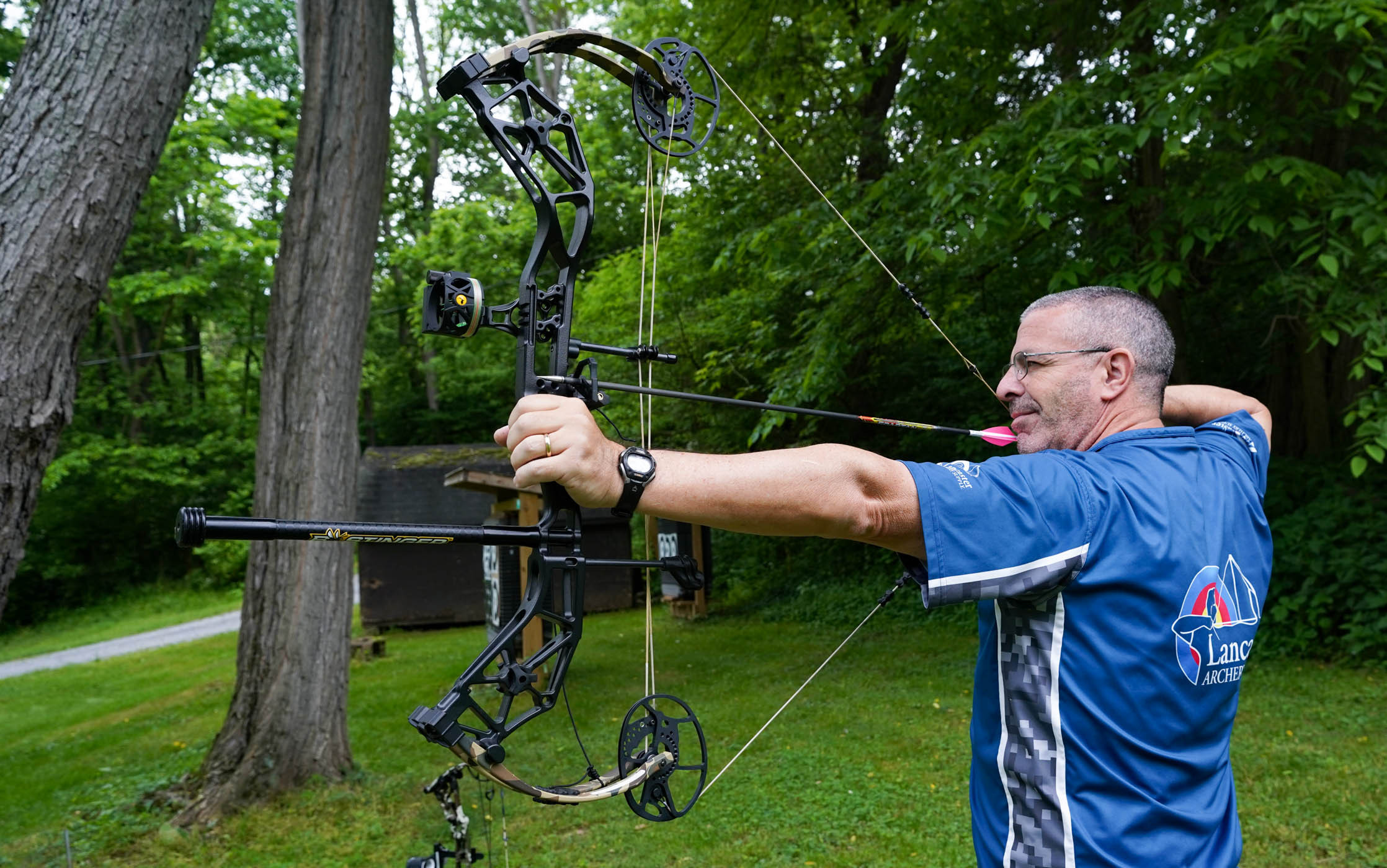 Bowhunter drawing a Bear Alaskan XT compound bow during testing