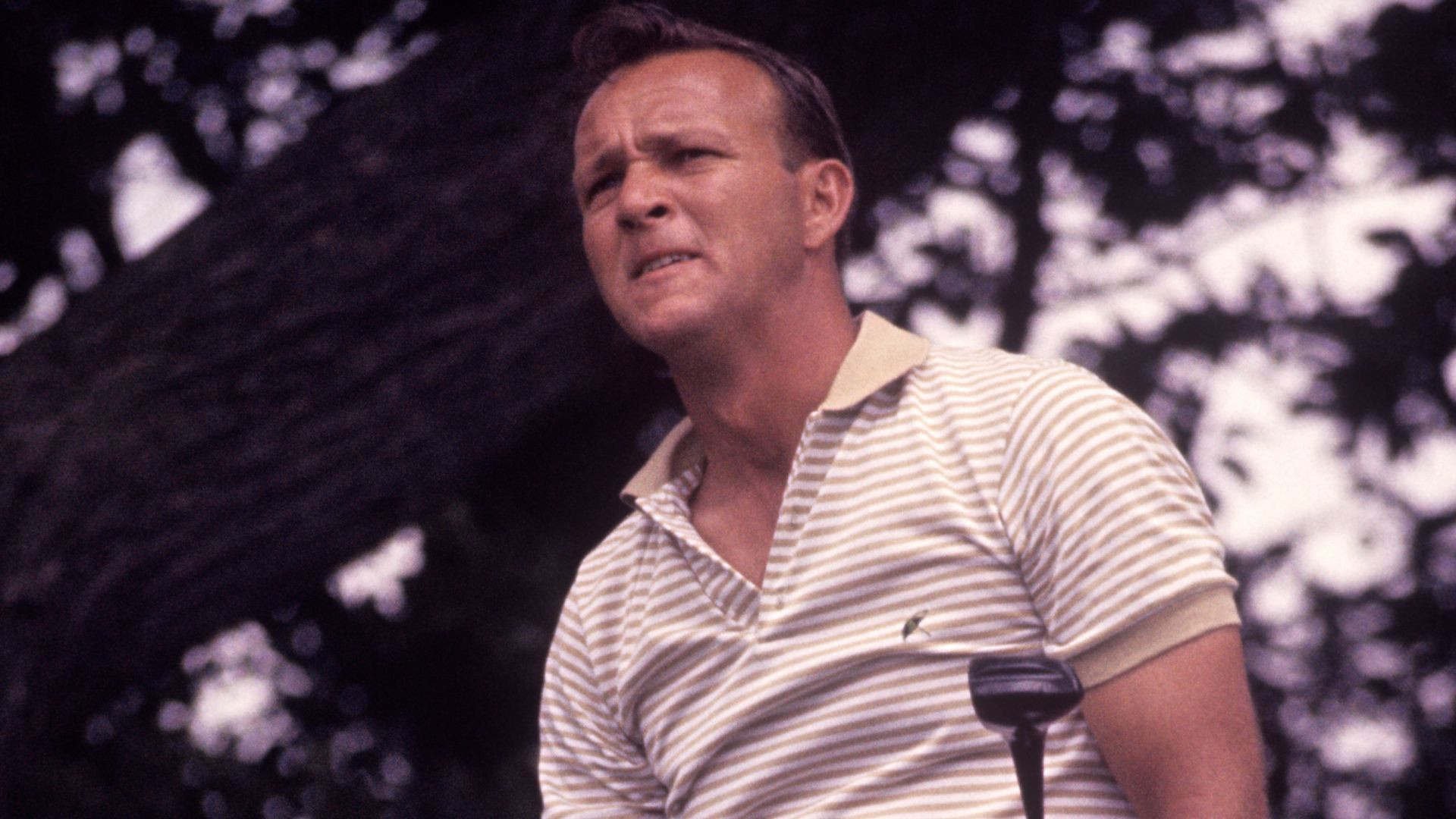 Arnold Palmer, a golf legend, competing at the 1963 US Open, the year he topped the PGA money list and surpassed $100,000 in earnings for the first time.