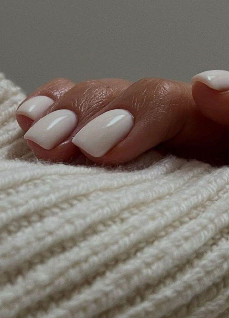 Creamy vanilla old money nails on almond shaped nails, glossy and smooth finish.