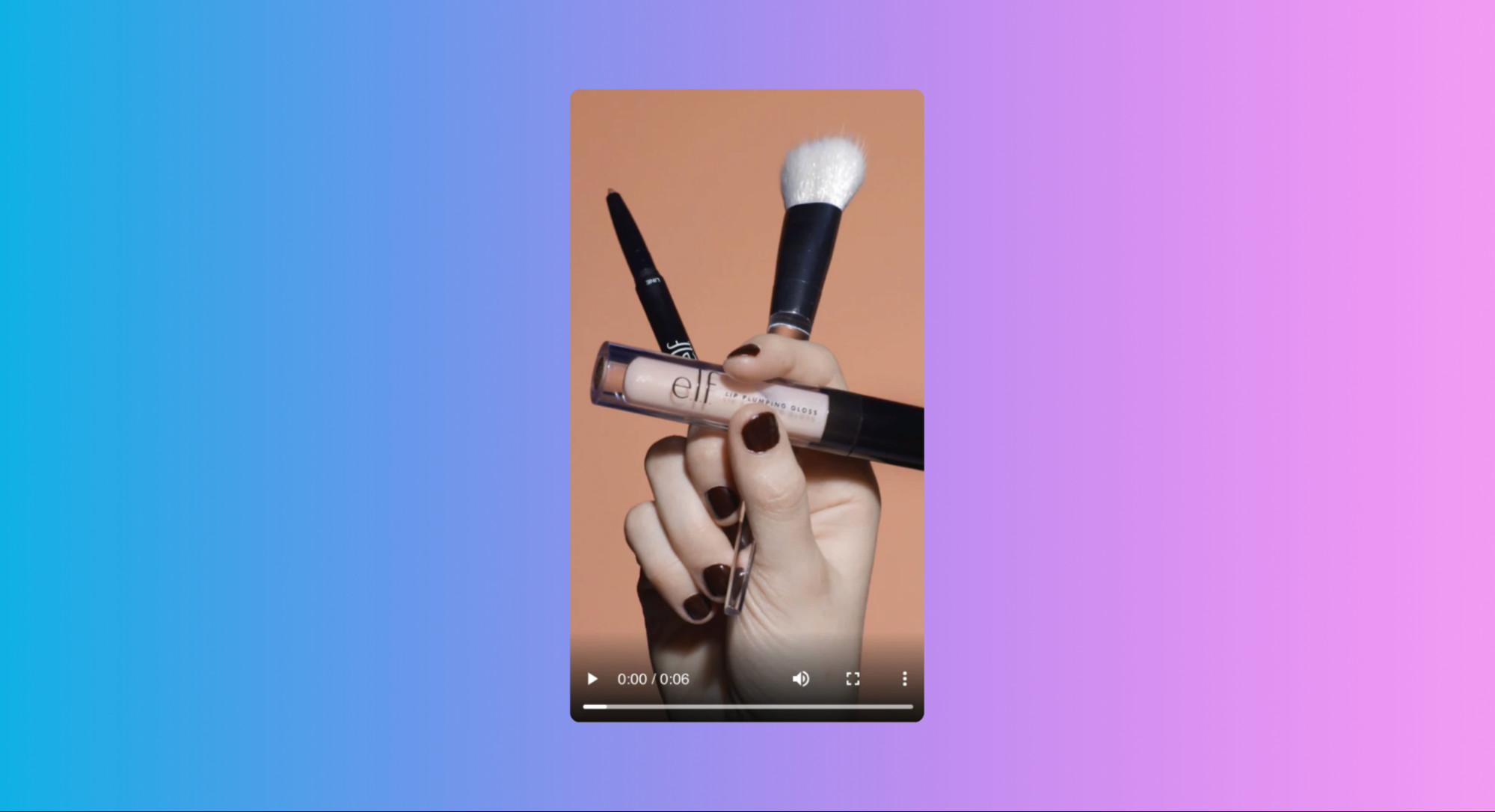 A still from a Snapchat video ad by e.l.f. Cosmetics, prominently displaying makeup products against a pink background, capturing attention immediately with product focus.