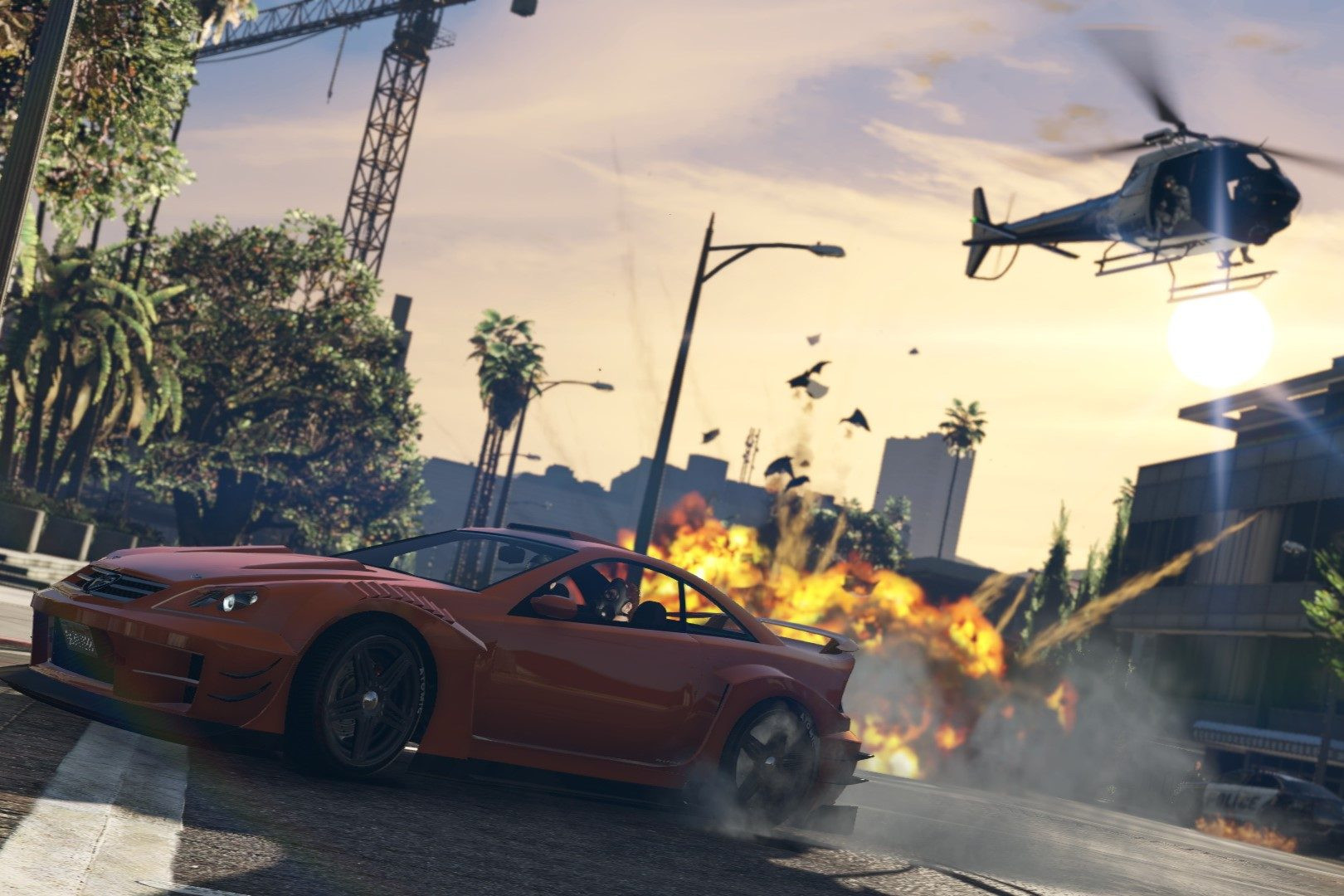 GTA 5 car chase with helicopter, and a red car driving away from an explosion