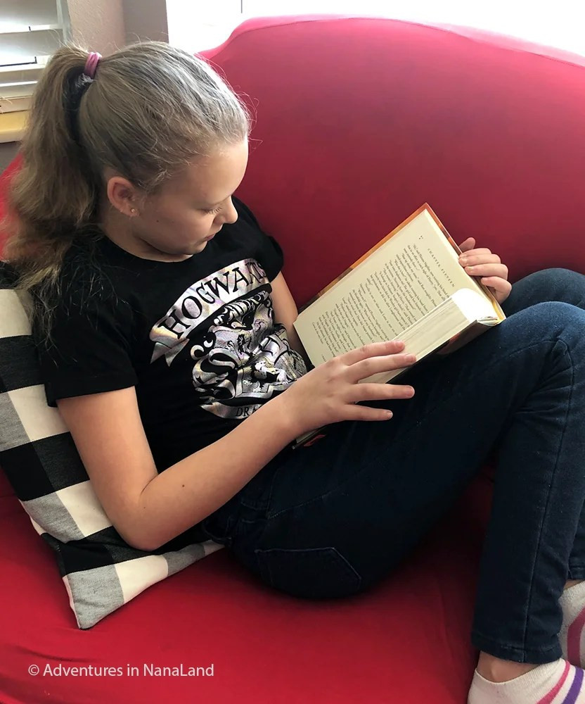 A young girl reading a book.