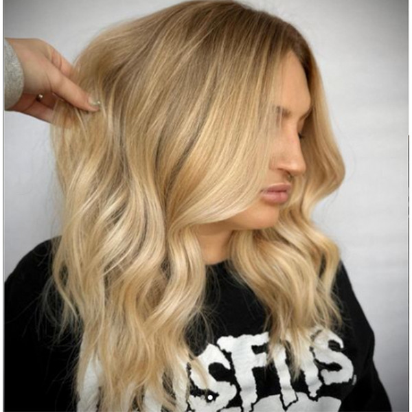 Warm toned old money blonde hair by Haley Clapp using Redken Shades EQ