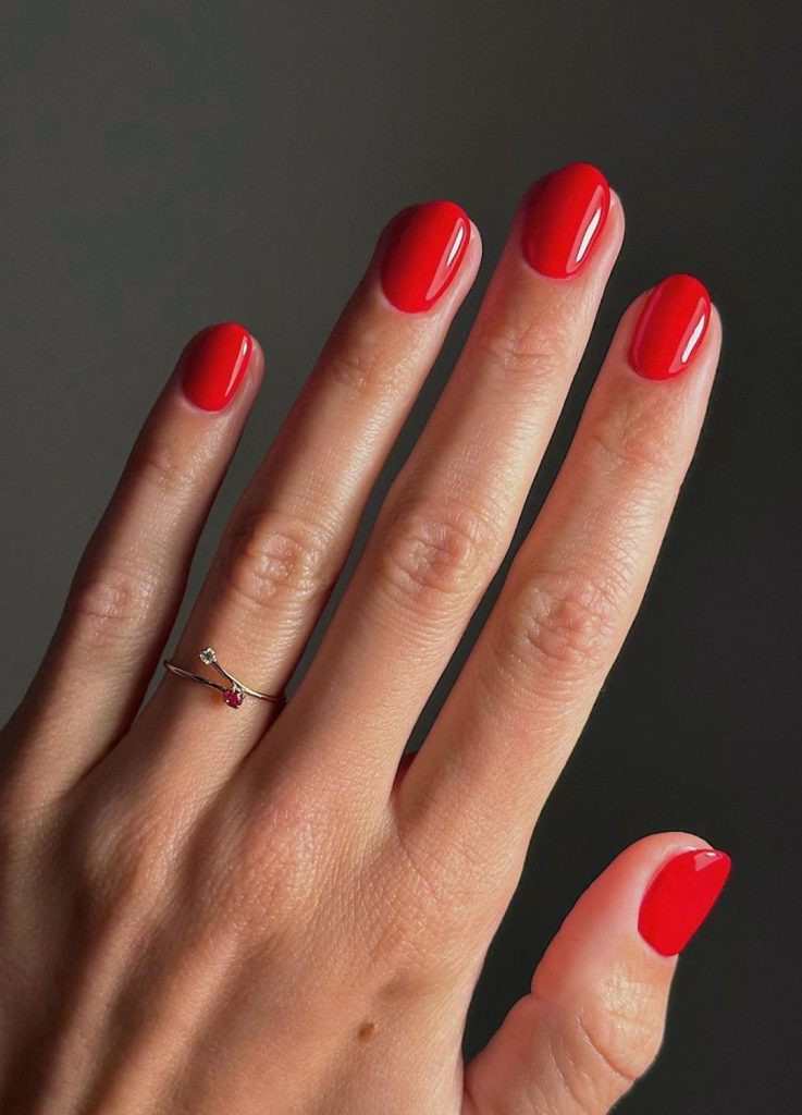 Classic red old money nails on short square shaped nails, high shine finish.