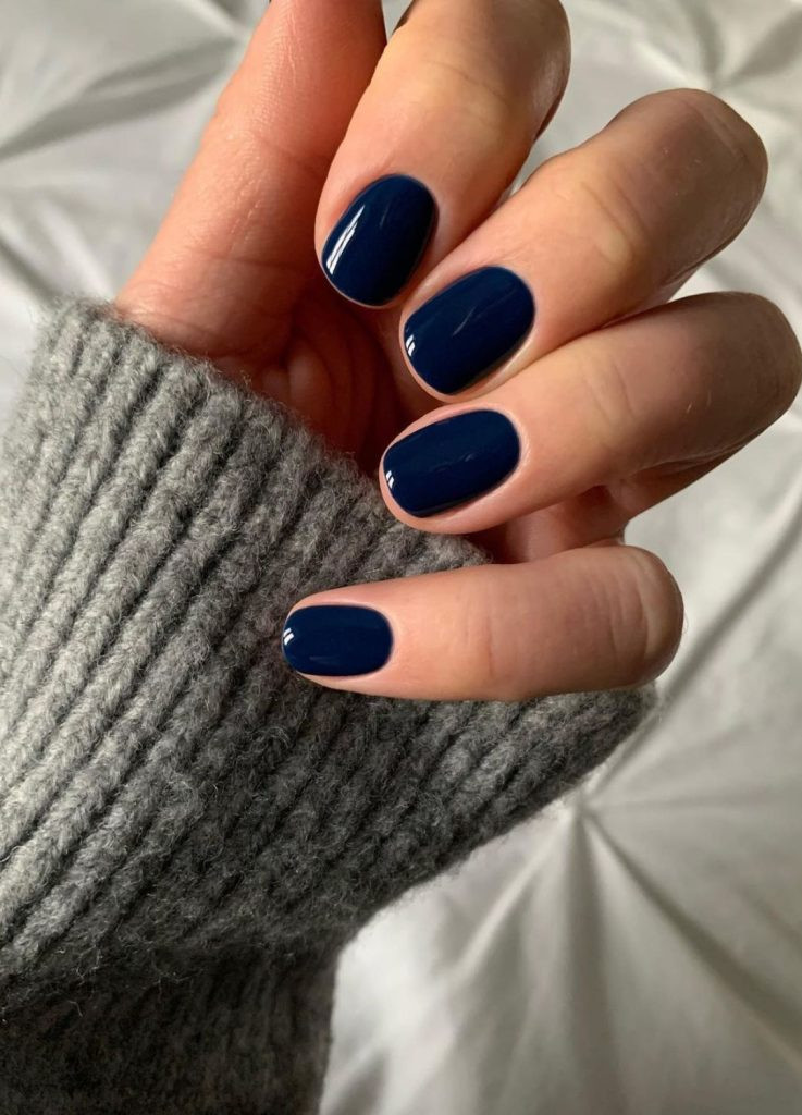 Navy blue old money nails on squoval shaped nails, deep and rich glossy color.