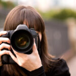 Woman taking a photo with her smartphone