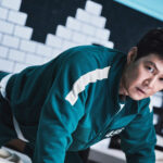 Seong Gi-hun in his blue Squid Game tracksuit