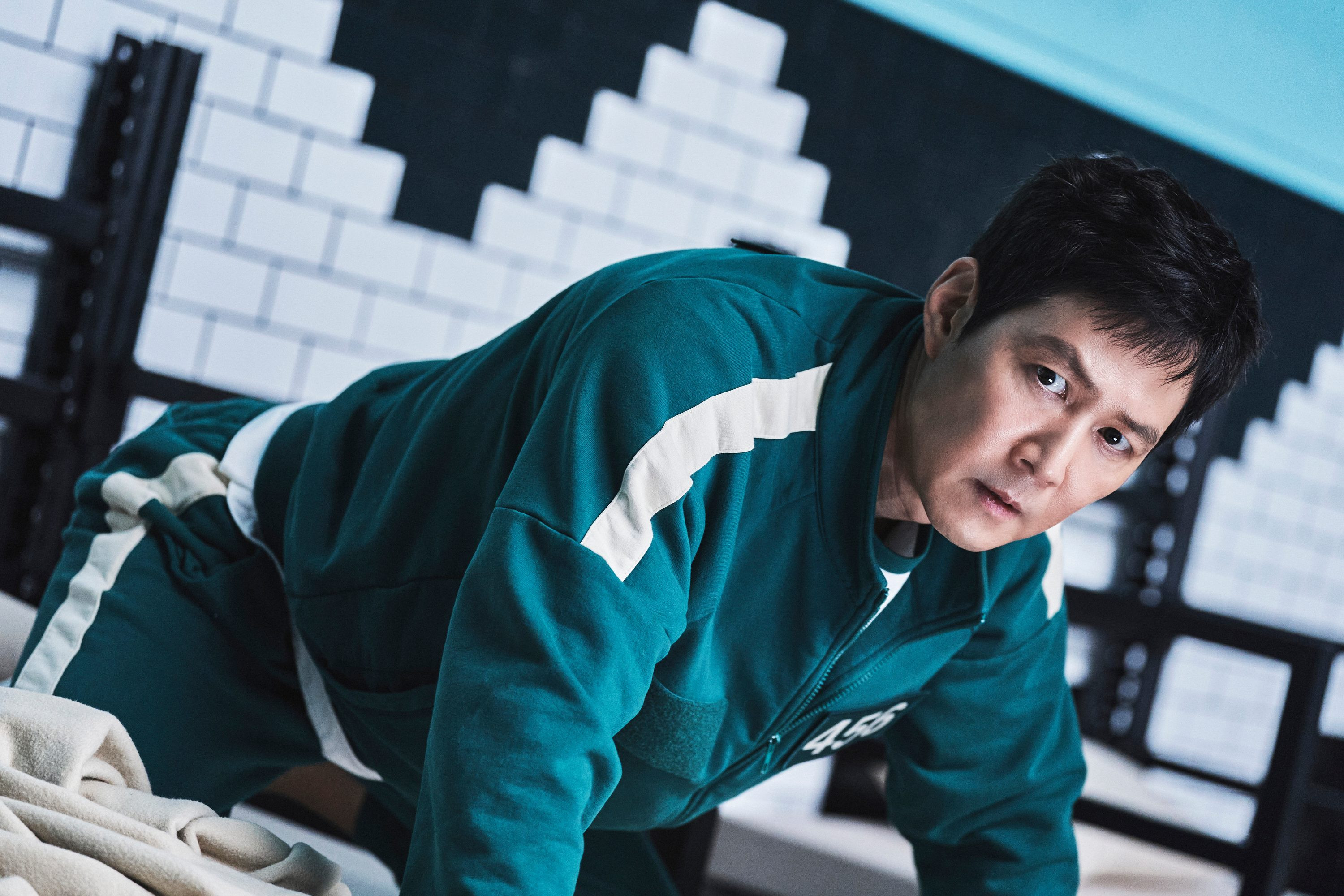 Seong Gi-hun in his blue Squid Game tracksuit