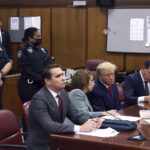 Former President Donald Trump appears in court with his legal team for an arraignment on charges stemming from his indictment by a Manhattan grand jury, in New York City, April 4, 2023.