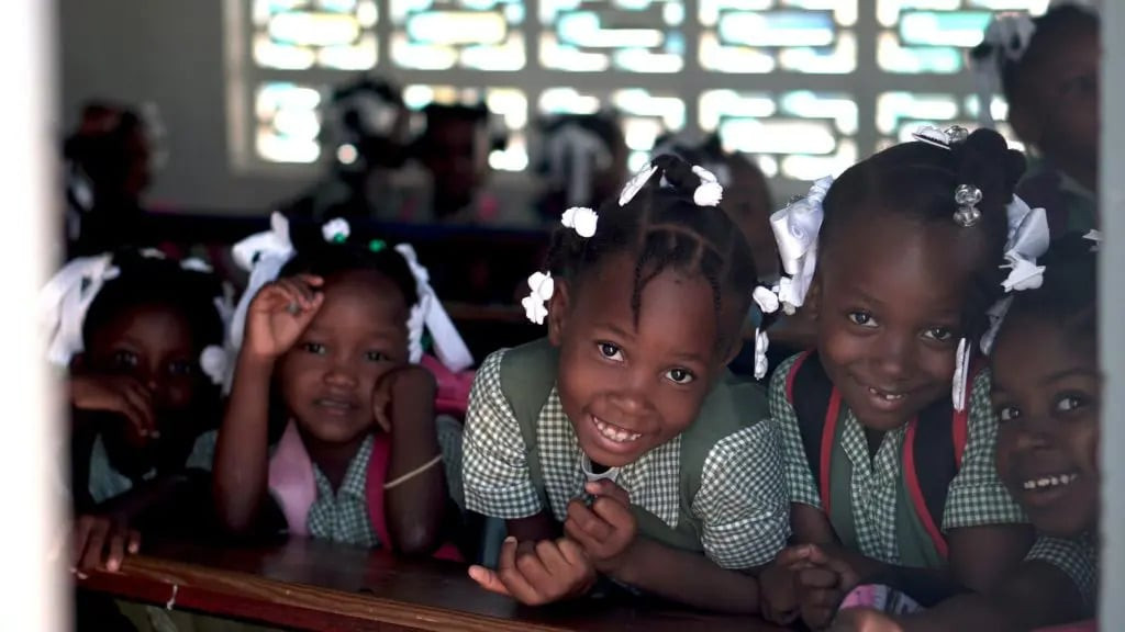 Young students smiling at the camera