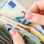 Euro banknotes and coins, the official currency of Germany