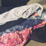 Pile of clothes taken into Clothes Mentor, showing only 1/3 returned