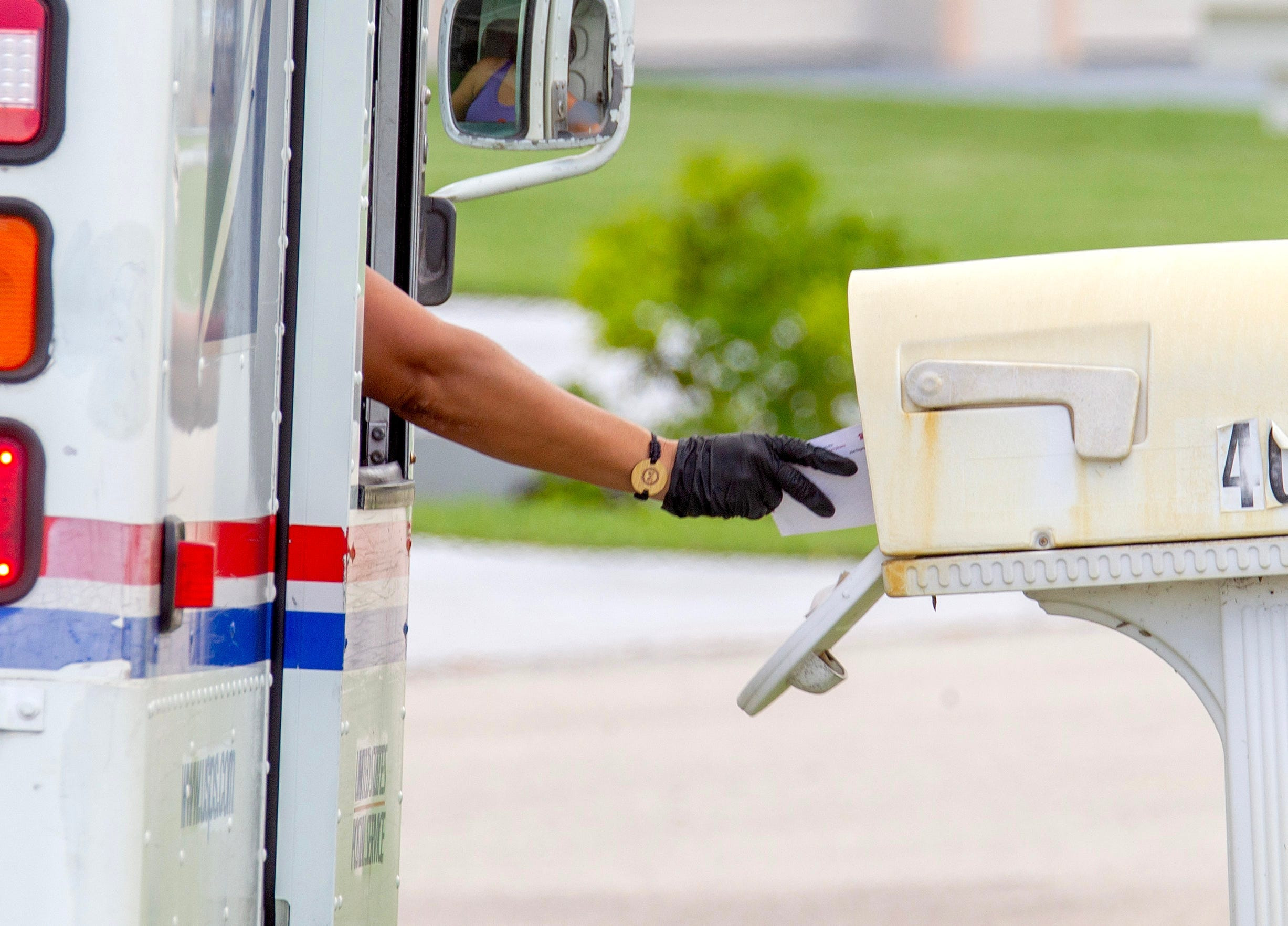 USPS truck delivering mail