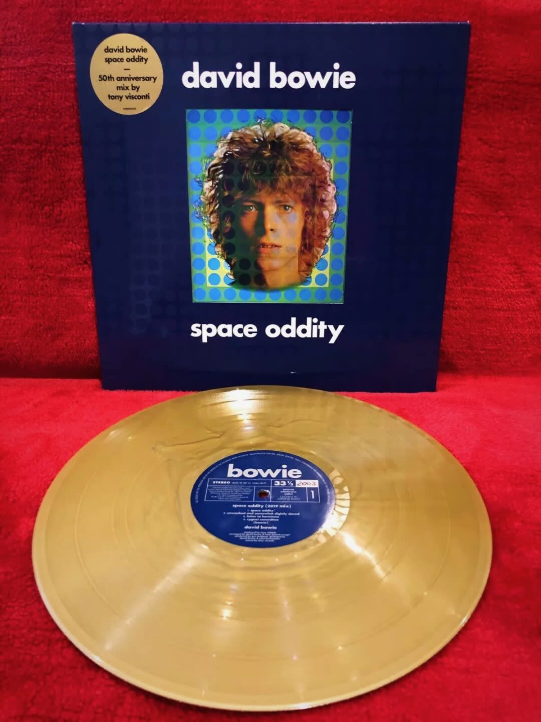 A David Bowie 'Space Oddity' gold disc, signifying its extreme rarity and connection to Bowie's breakout hit.