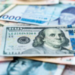 Coins and paper money representing global currency holdings