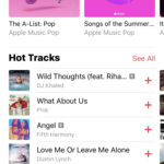 Person listening to music with Apple Music on their iPhone