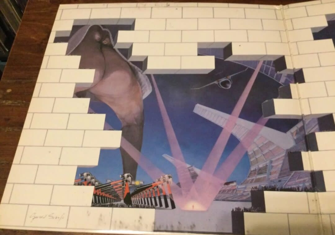 Surreal illustration featuring a brick wall with some parts missing, revealing a scene with an elephant, spotlights, and a stadium, which enhances its worth.