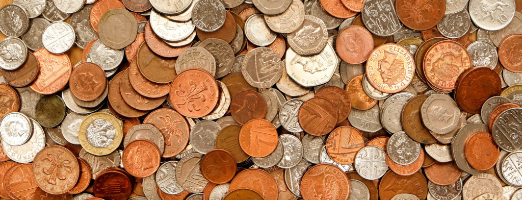 UK currency featuring a variety of coins in copper and silver colors