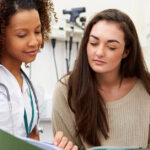 Nurse discussing treatment with a patient