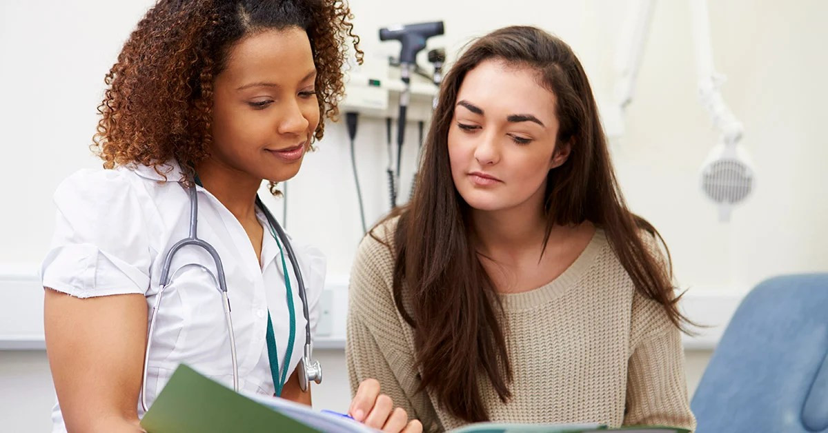 Nurse discussing treatment with a patient