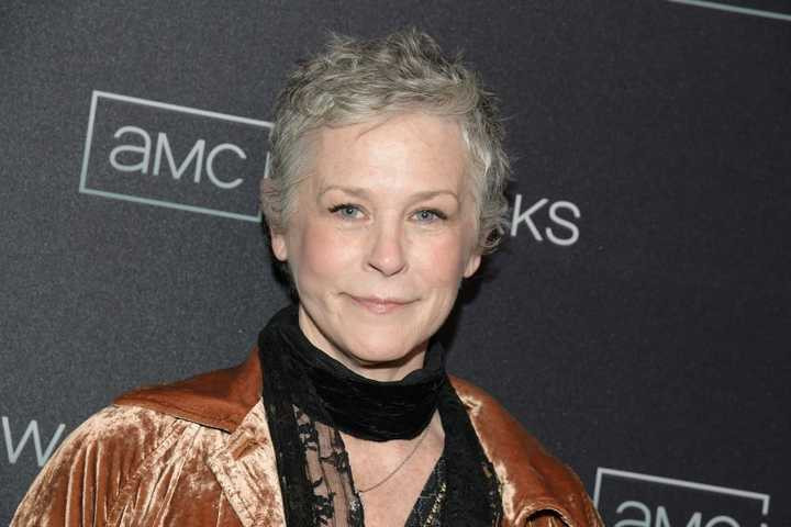 Melissa McBride at the AMC Networks Upfront Red Carpet held at Chelsea Factory in New York City, demonstrating her successful career and substantial earnings from The Walking Dead