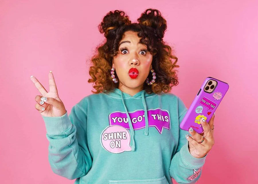 Color Me Courtney wearing her brand's merch to promote her product