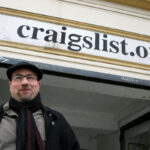 Craigslist founder, Craig Newmark, poses in front of his company