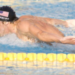 Michael Phelps at a young age, swimming with determination