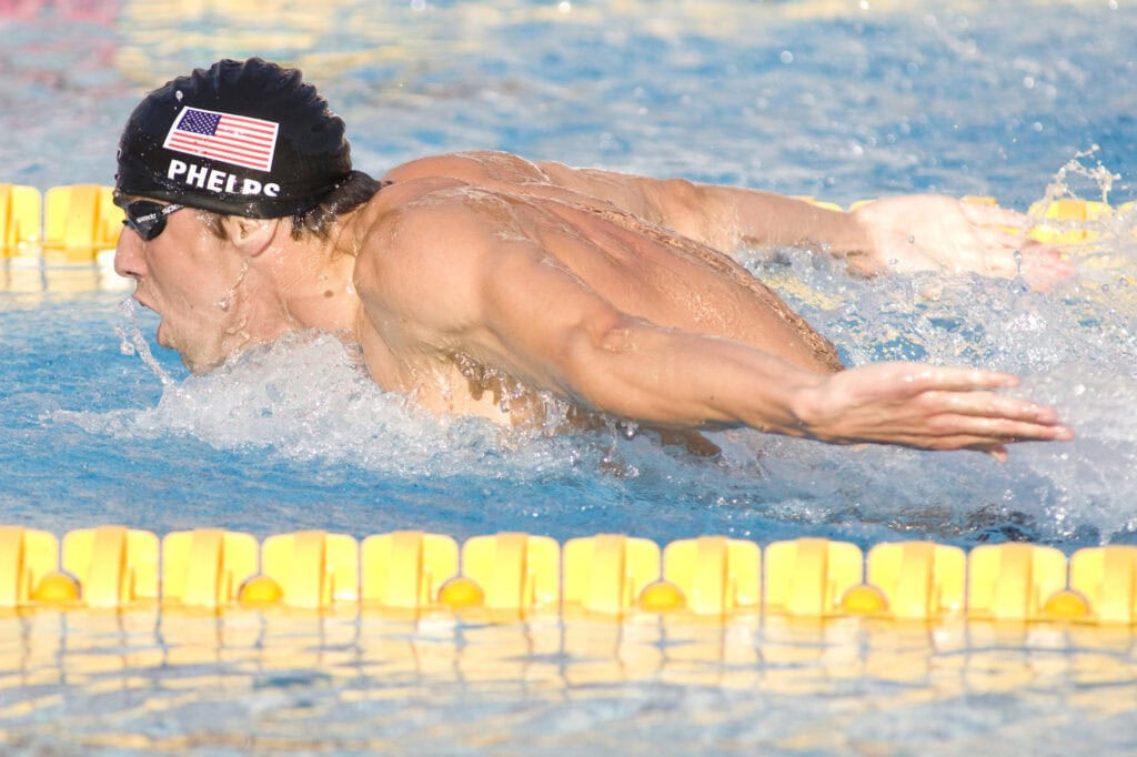 Michael Phelps at a young age, swimming with determination