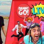 Danny Go posing for the camera and a poster of Danny Go Show