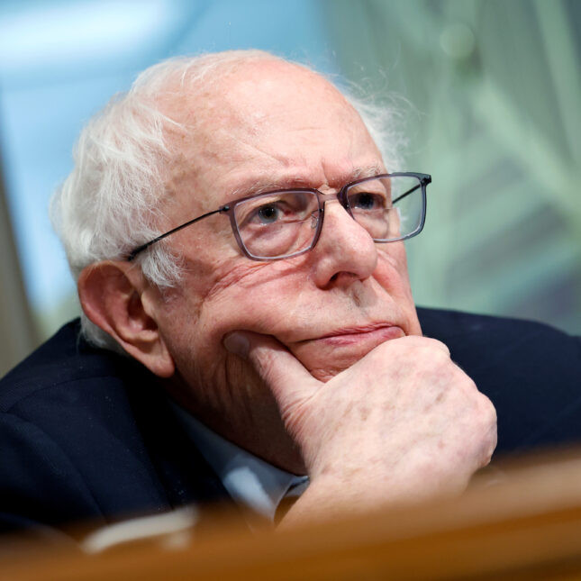 Sen. Bernie Sanders with his hand on his face, displaying. puzzled look. -- health policy coverage from STAT