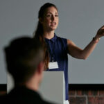 Professor lecturing students in a university classroom, demonstrating the role of educators