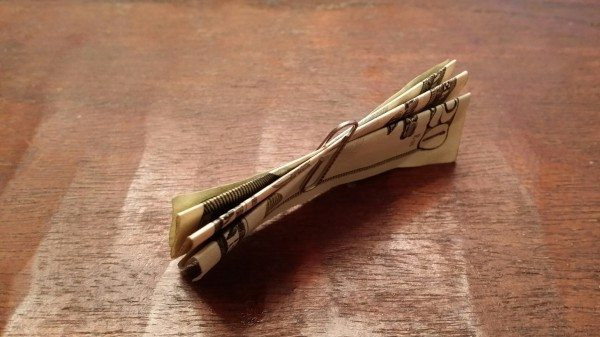 Tie the bill in a knot with about 18” of ribbon and curl it using the edge of your scissors