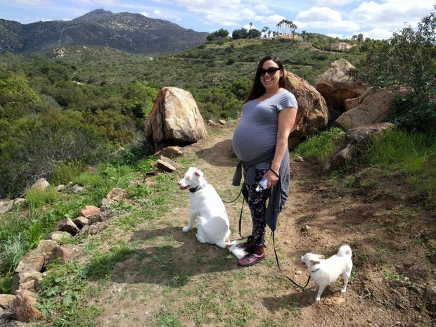 Sunshine Hanson is pictured pregnant during one of her surrogacy journeys, showcasing the dedication and commitment required for this life-changing experience