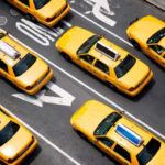 A picture of several yellow cabs driving through NYC begs the question,