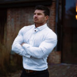 Tom Coleman for Oxcloth wearing a white muscle fit shirt