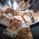 Money Laundering - Image of EU bank notes in a washing machine