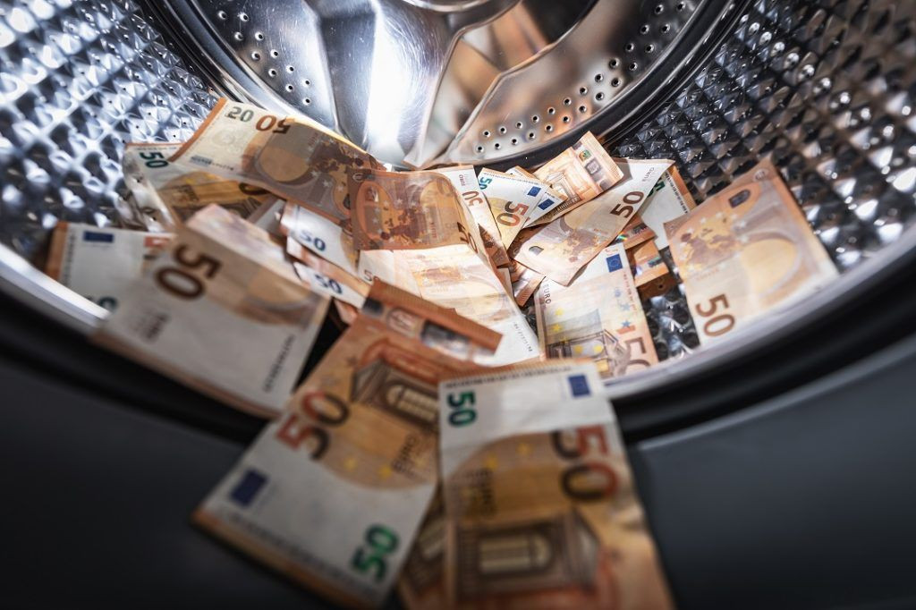 Money Laundering - Image of EU bank notes in a washing machine