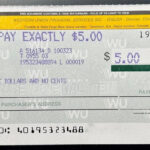 A close-up of the signature line on a money order, highlighting its importance