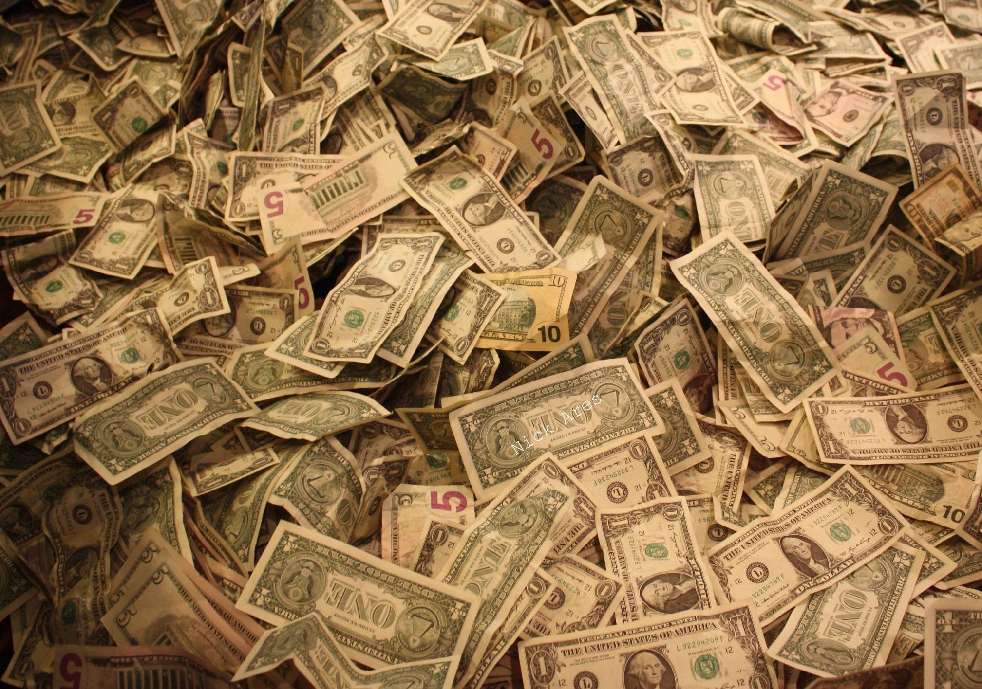 The moment money is distributed on the money pile
