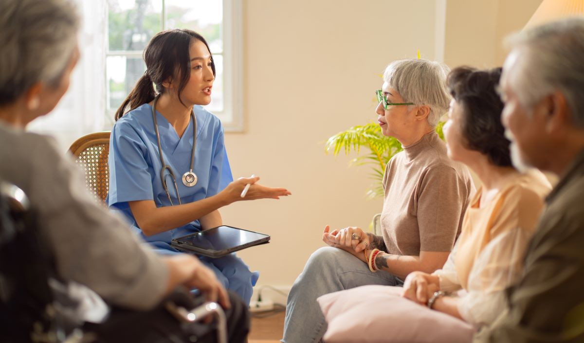Nurse consulting group of patients