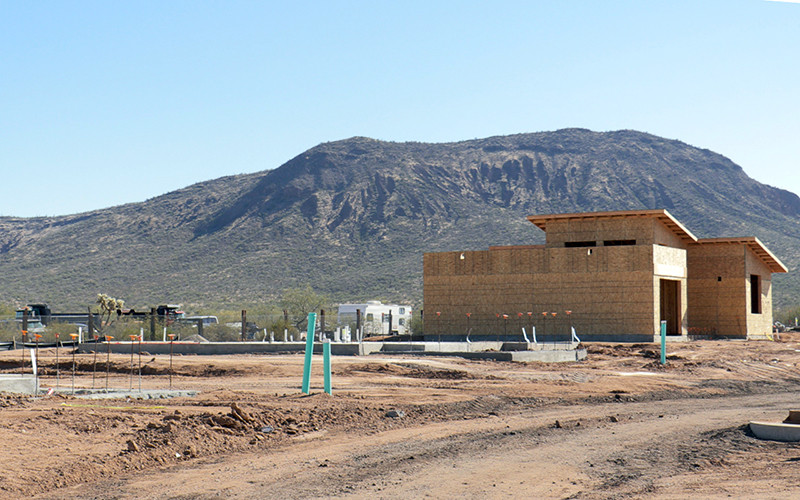 Construction crew member working on home exterior