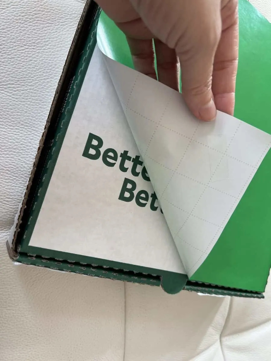 Taping background to pizza box