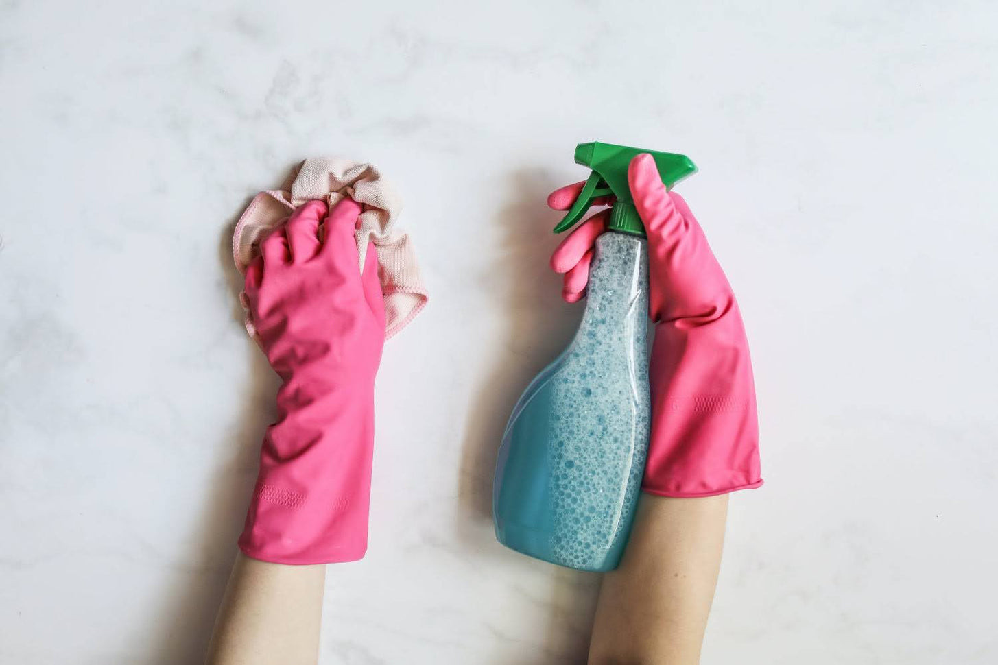 Hands cleaning with spray, representing service-based businesses
