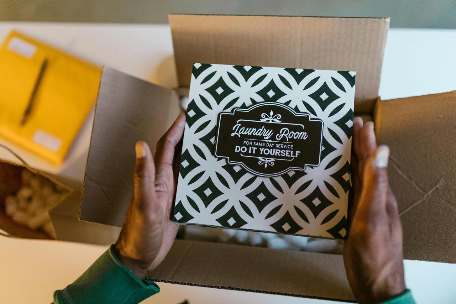 Person packing product, illustrating creating your brand